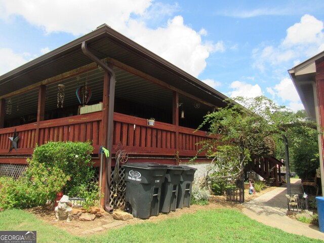 view of side of home with a deck