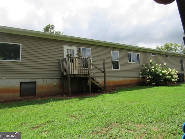 back of house with a yard