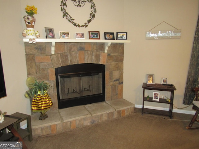 interior details featuring a fireplace and carpet