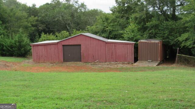 2296 Athens Rd, Royston, GA 30662 - view of outdoor structure with a view of trees and an outbuilding