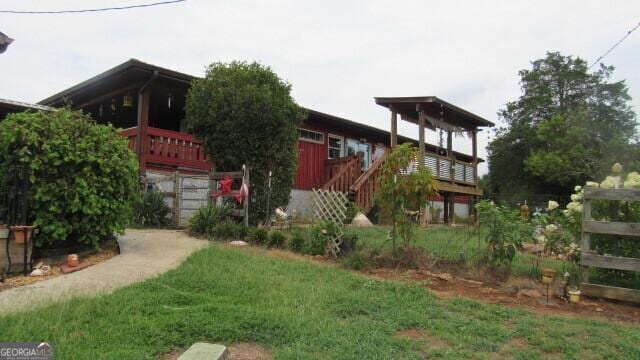 view of yard featuring a wooden deck