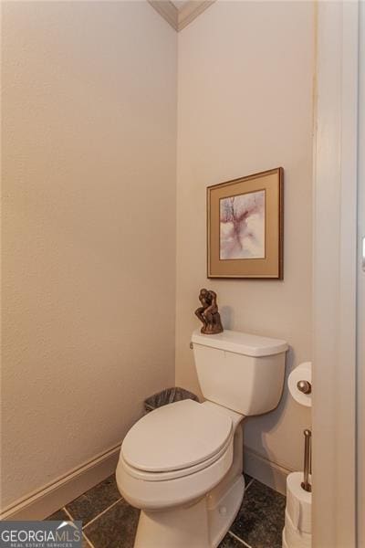 bathroom with tile patterned flooring and toilet