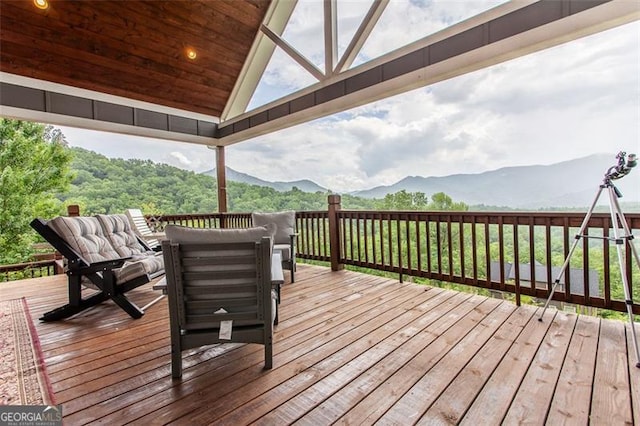 wooden terrace featuring a mountain view