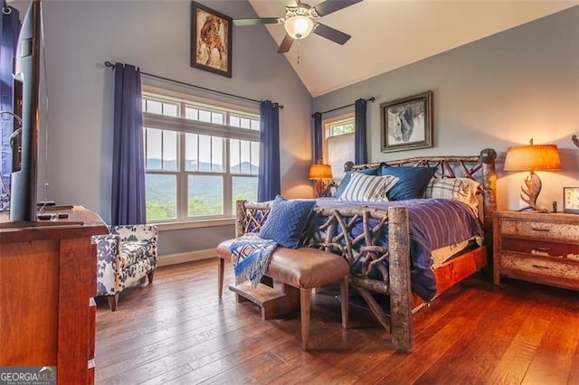 bedroom featuring lofted ceiling, hardwood / wood-style flooring, and ceiling fan