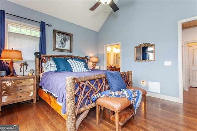 bedroom with connected bathroom, hardwood / wood-style floors, high vaulted ceiling, and ceiling fan