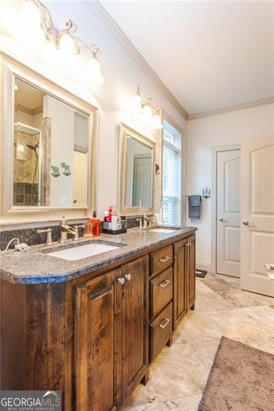 bathroom with double sink vanity, crown molding, and tile patterned flooring