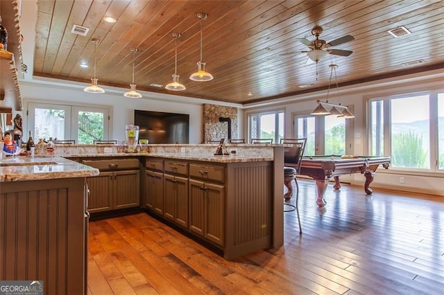 kitchen with pool table, wood-type flooring, hanging light fixtures, and wood ceiling