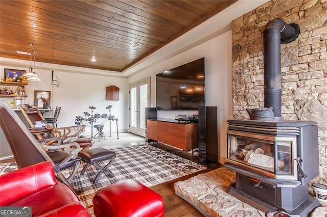 living room featuring wood ceiling, french doors, hardwood / wood-style flooring, and a wood stove