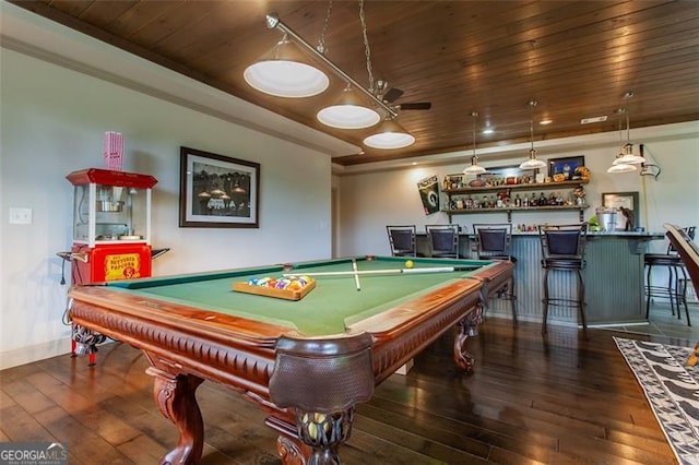 recreation room with pool table, indoor bar, wood ceiling, a tray ceiling, and dark hardwood / wood-style floors