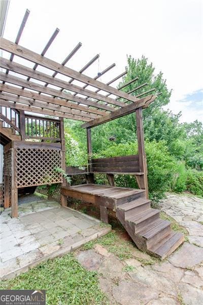 view of patio featuring a pergola and a wooden deck