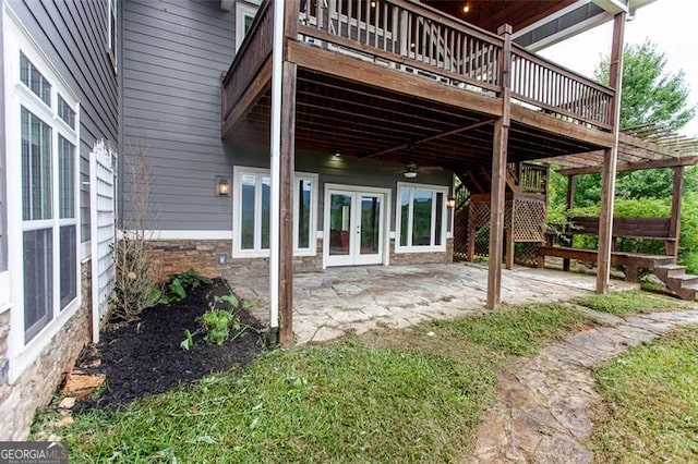 view of patio featuring a deck and french doors