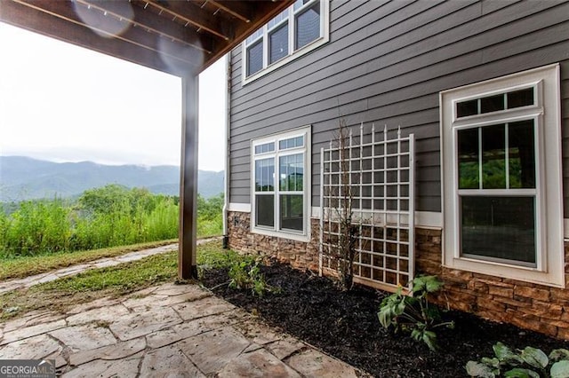 view of patio / terrace with a mountain view