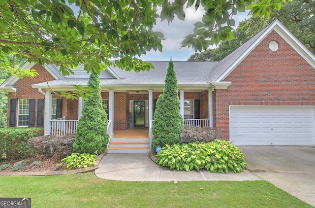 view of front of house with a garage and covered porch