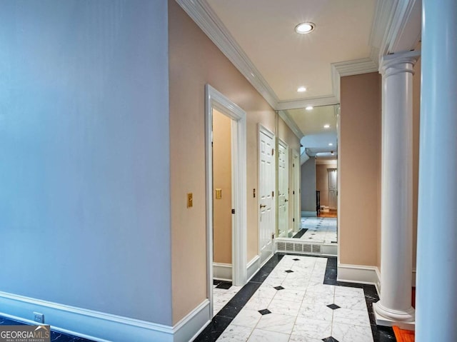 hall with ornamental molding, ornate columns, and tile patterned floors