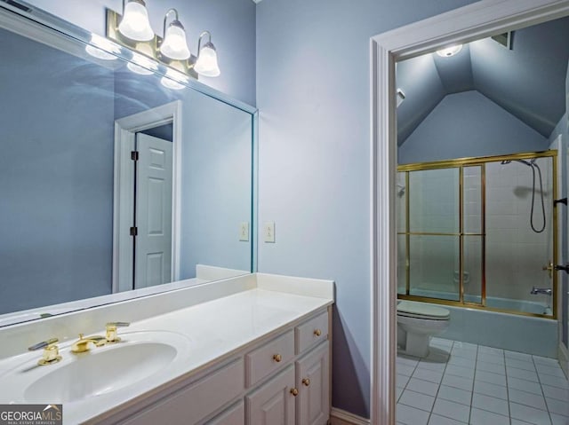 full bathroom with vanity, enclosed tub / shower combo, vaulted ceiling, toilet, and tile patterned flooring