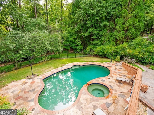 view of swimming pool with a yard, an in ground hot tub, and a patio