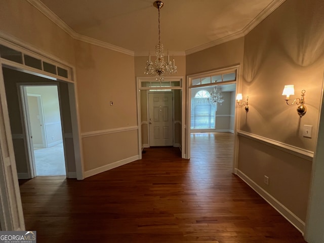 interior space with a notable chandelier, ornamental molding, and wood-type flooring