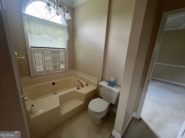 bathroom with crown molding, toilet, and a tub to relax in