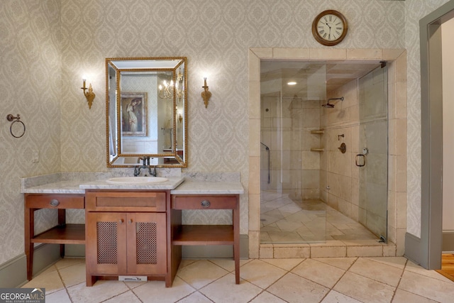 bathroom featuring vanity, an enclosed shower, and tile patterned flooring