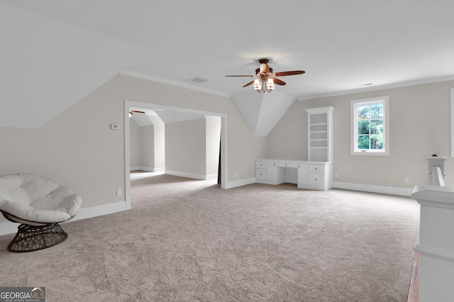 bonus room with vaulted ceiling, light colored carpet, and ceiling fan