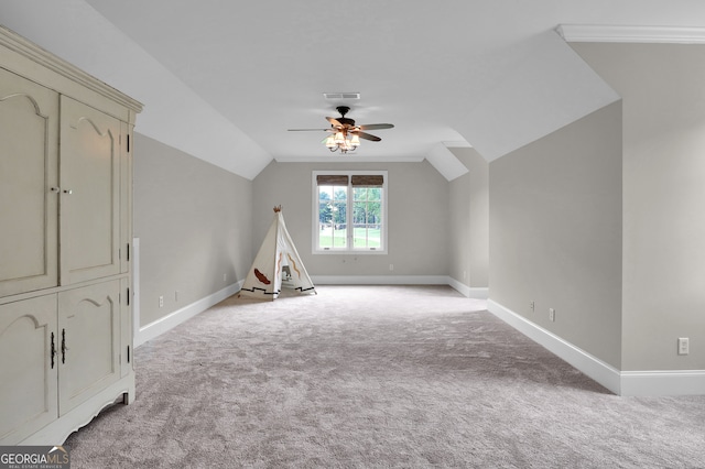 bonus room featuring ceiling fan, lofted ceiling, and light colored carpet