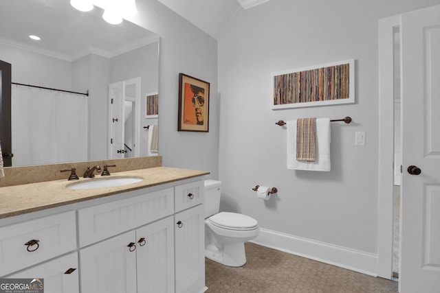 bathroom with vanity, tile patterned flooring, toilet, and crown molding