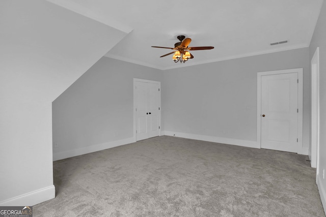 additional living space with carpet and ceiling fan