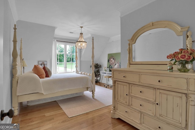 bedroom featuring light wood-type flooring and ornamental molding