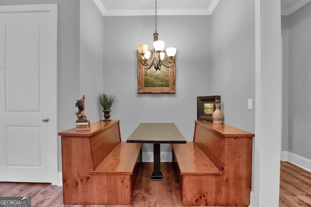 interior space with crown molding, hardwood / wood-style floors, and a chandelier