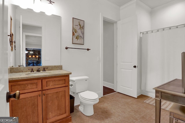 bathroom featuring tile patterned floors, toilet, vanity, and ornamental molding