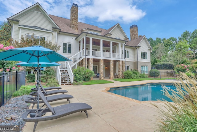 view of pool with a patio area and a sunroom