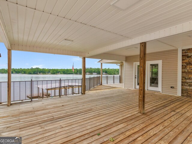 wooden terrace with a water view