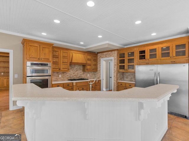 kitchen with stainless steel appliances, premium range hood, a breakfast bar, and a spacious island