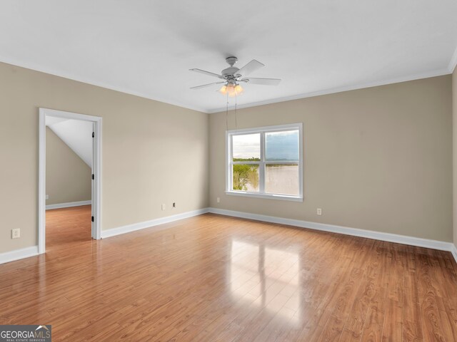 unfurnished room featuring ceiling fan, ornamental molding, and light wood-type flooring