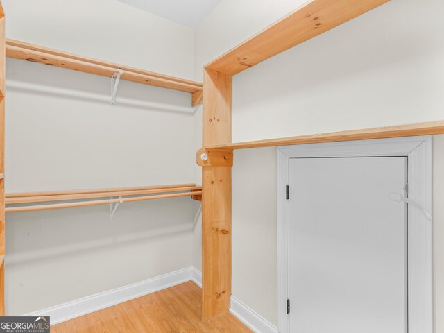 walk in closet featuring hardwood / wood-style floors