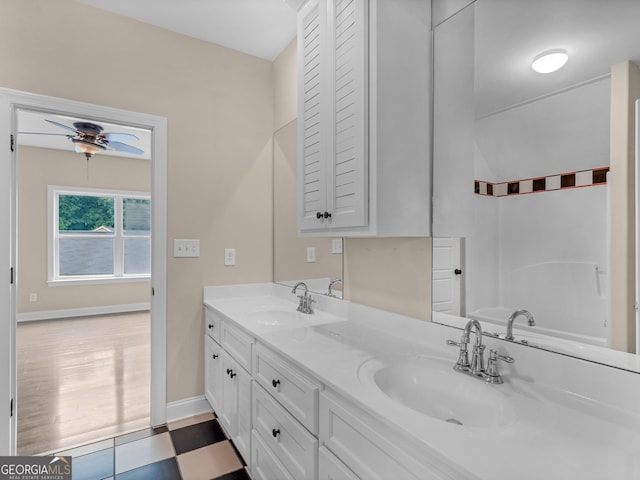 10766 Ga Highway 212, Monticello, GA 31064 - full bath with double vanity, baseboards, and a tub