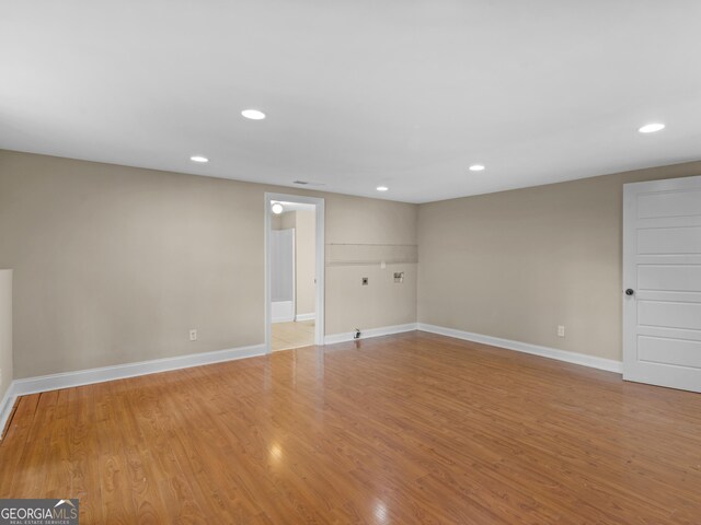 spare room featuring light hardwood / wood-style flooring