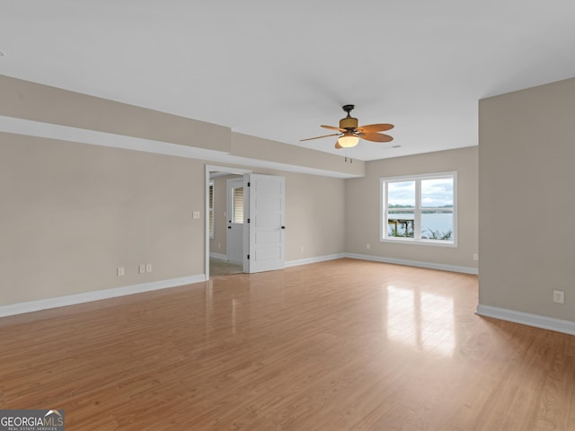 10766 Ga Highway 212, Monticello, GA 31064 - empty room with a ceiling fan, baseboards, and light wood-style flooring