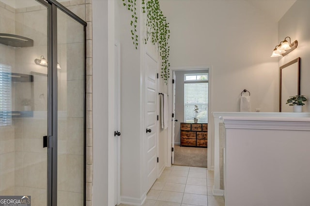 bathroom featuring walk in shower and tile patterned floors