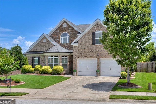 view of front of property featuring a garage and a front yard