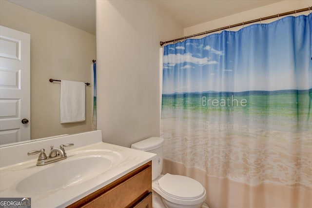 bathroom with vanity and toilet