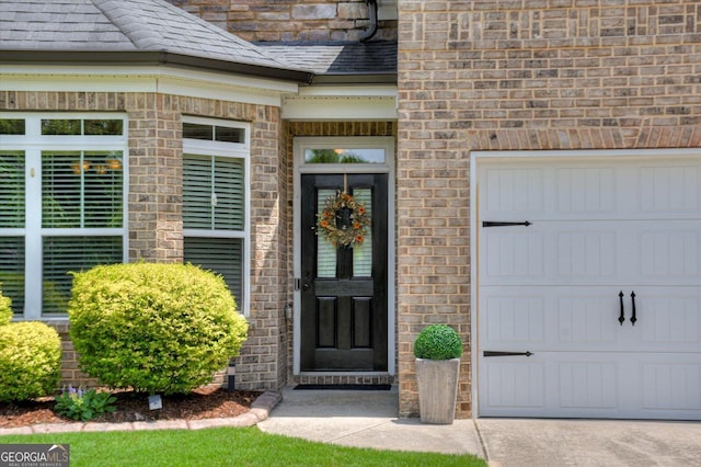 entrance to property featuring a garage