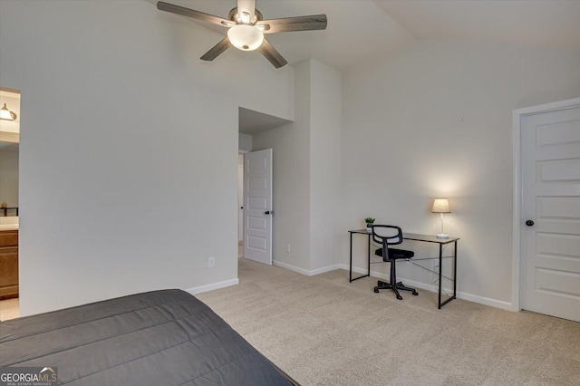 carpeted bedroom with connected bathroom and high vaulted ceiling