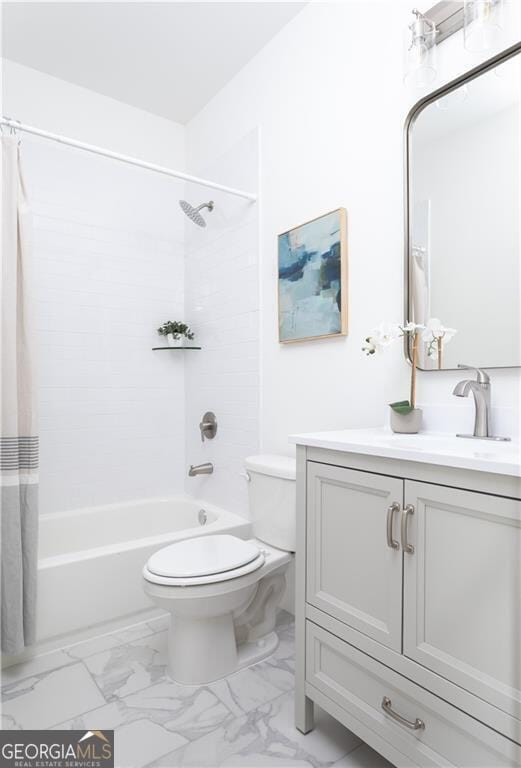 full bathroom featuring tile patterned flooring, shower / bath combo with shower curtain, toilet, and vanity