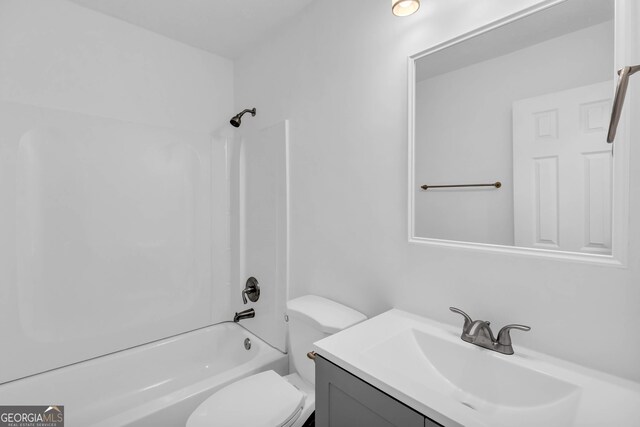 full bathroom featuring toilet, shower / bathtub combination, and vanity