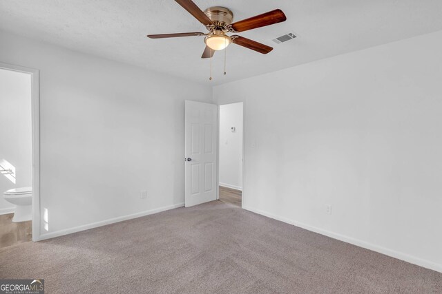 unfurnished room with carpet and ceiling fan