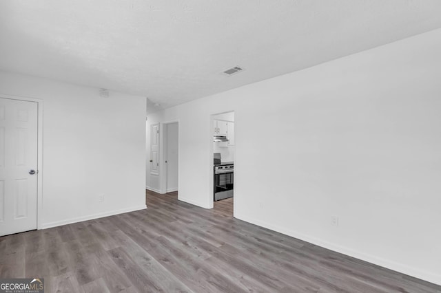 unfurnished room featuring hardwood / wood-style floors