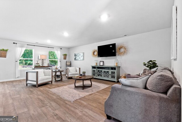 living room with light hardwood / wood-style floors