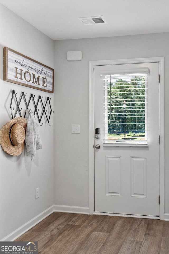 entryway with hardwood / wood-style flooring