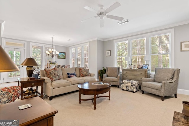 living room with light colored carpet, ornamental molding, and ceiling fan with notable chandelier